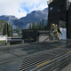 An action shot of Halo Infinite depicting a spartan charging across a metal walkway, gun in hand.